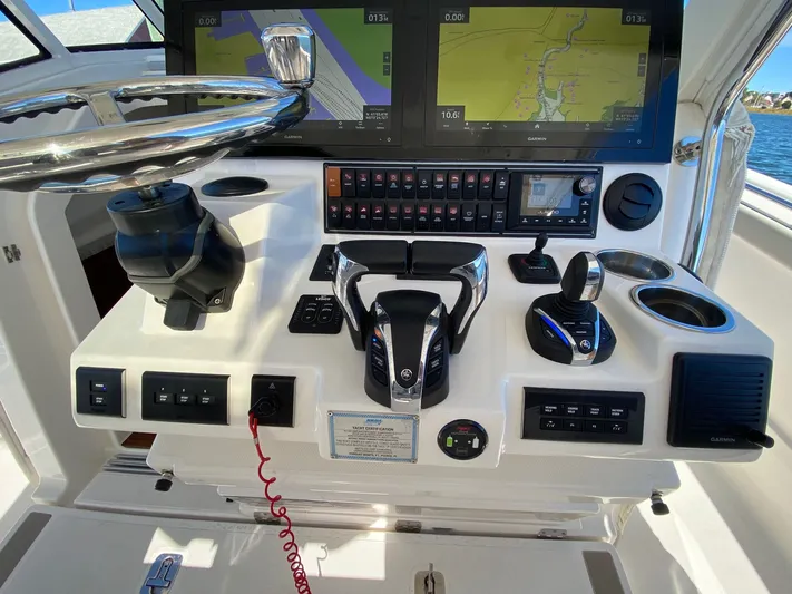  Yacht Photos Pics 2022 Pursuit 378S helm with advanced navigation and control systems.
