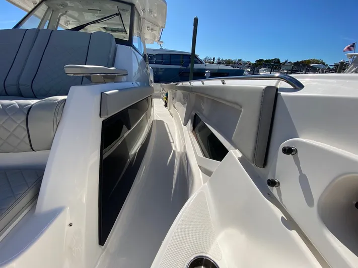  Yacht Photos Pics 2022 Pursuit 378S boat interior with sleek seating and modern design.