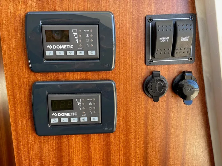  Yacht Photos Pics Control panel on 2022 Pursuit 378S boat with Dometic displays and light switches.