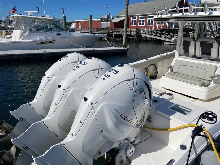  Yacht Photos Pics 2022 Pursuit 378S boat with triple Yamaha 425 engines docked at marina.