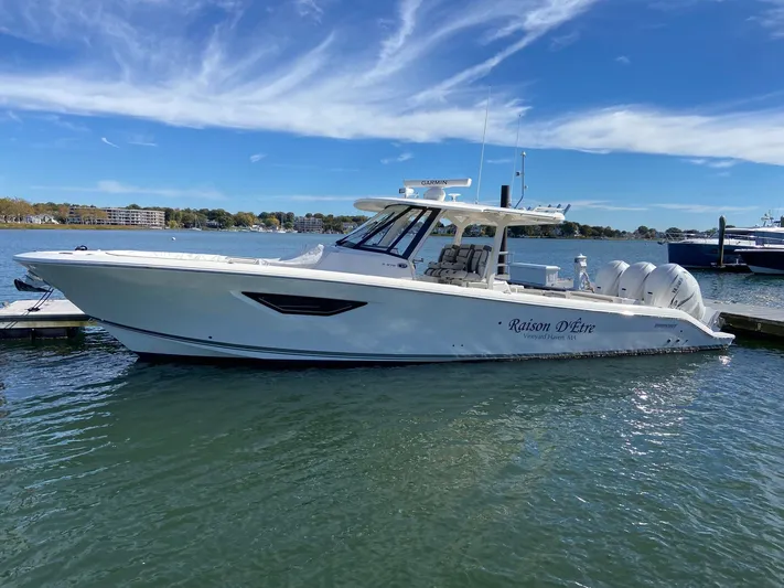  Yacht Photos Pics 2022 Pursuit 378S boat docked on a sunny day with clear skies.