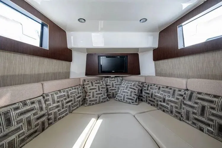 Raison D'&Ecirc;tre Yacht Photos Pics Interior of 2022 Pursuit S 378 Sport with cozy seating area.