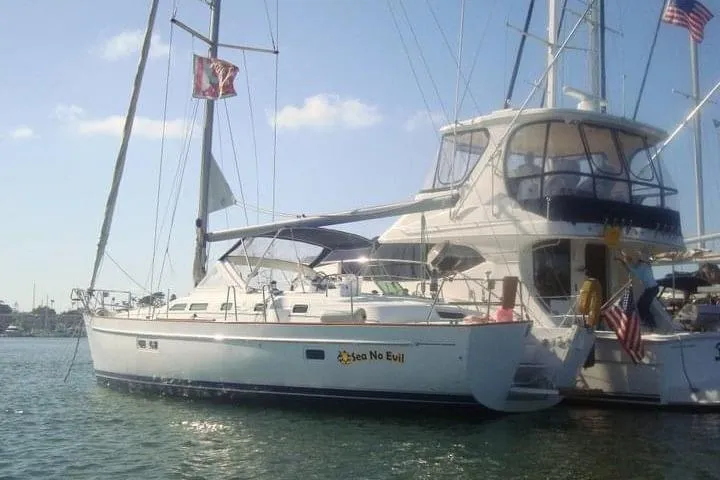  Yacht Photos Pics 2003 Beneteau Oceanis 42CC sailboat docked in sunny marina.