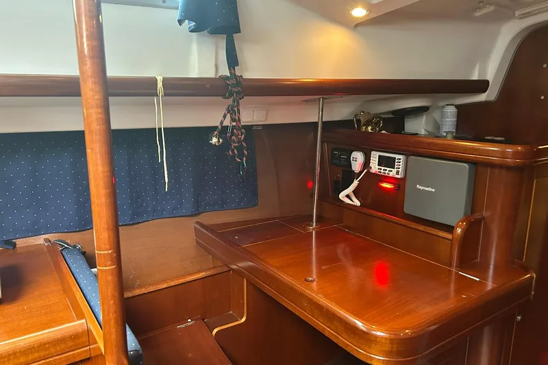 Sea No Evil Yacht Photos Pics Interior of 2003 Beneteau Oceanis 42CC yacht with navigation equipment and wooden finish.