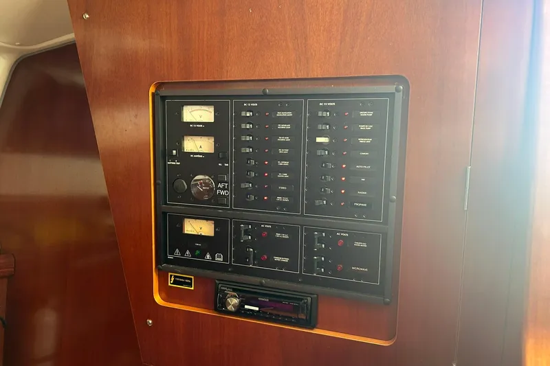 Sea No Evil Yacht Photos Pics Electrical control panel on a 2003 Beneteau Oceanis 42CC sailboat interior.