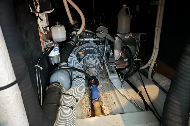 Sea No Evil Yacht Photos Pics Engine room of a 2003 Beneteau Oceanis 42CC sailboat, showcasing mechanical components.