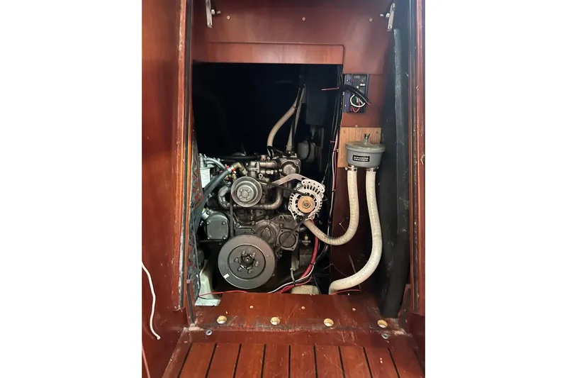 Sea No Evil Yacht Photos Pics Engine compartment of 2003 Beneteau Oceanis 42CC sailboat, showcasing mechanical components.