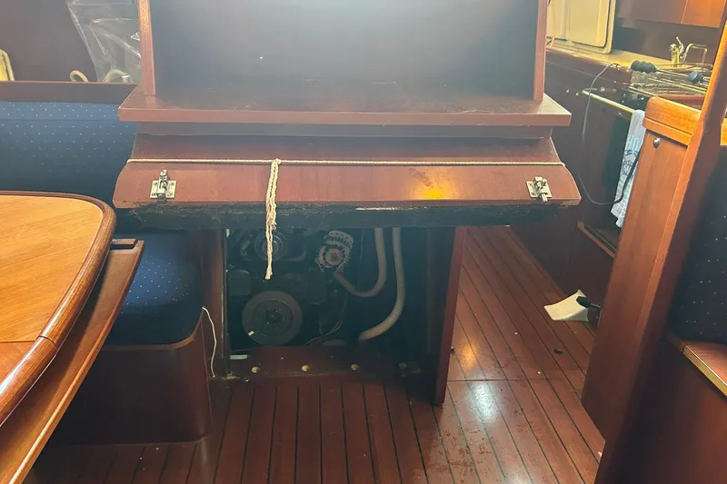 Sea No Evil Yacht Photos Pics Engine compartment of 2003 Beneteau Oceanis 42CC sailboat with wooden interior.