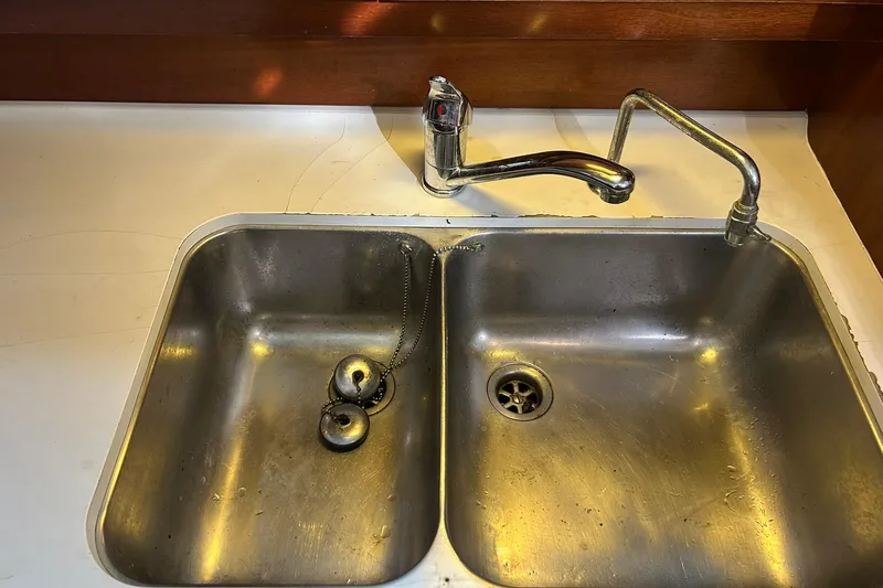 Sea No Evil Yacht Photos Pics Stainless steel double sink with faucet on Beneteau Oceanis 42CC yacht, 2003 model.
