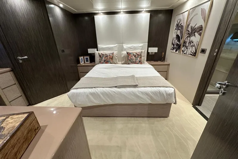  Yacht Photos Pics Luxurious bedroom interior of 2021 Terranova Yachts T85, featuring elegant decor and modern furnishings.