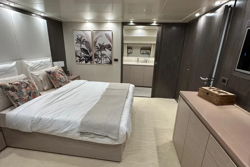  Yacht Photos Pics Luxurious bedroom interior of 2021 Terranova Yachts T85, featuring elegant decor and modern amenities.
