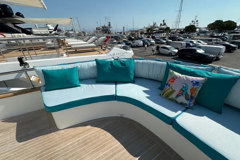  Yacht Photos Pics Luxurious seating area on 2021 Terranova Yachts T85, featuring vibrant cushions and marina view.