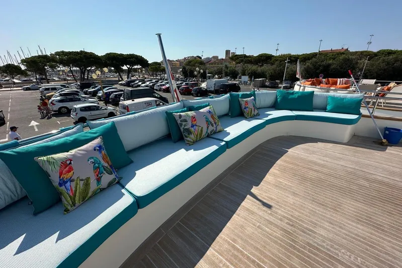  Yacht Photos Pics Luxurious 2021 Terranova Yachts T85 deck with vibrant cushions and scenic marina view.