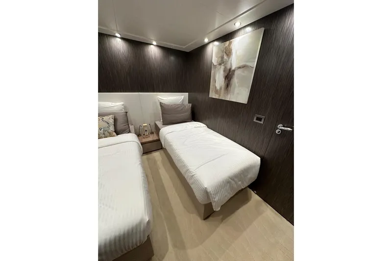  Yacht Photos Pics Luxurious cabin interior of 2021 Terranova Yachts T85 with twin beds and modern decor.