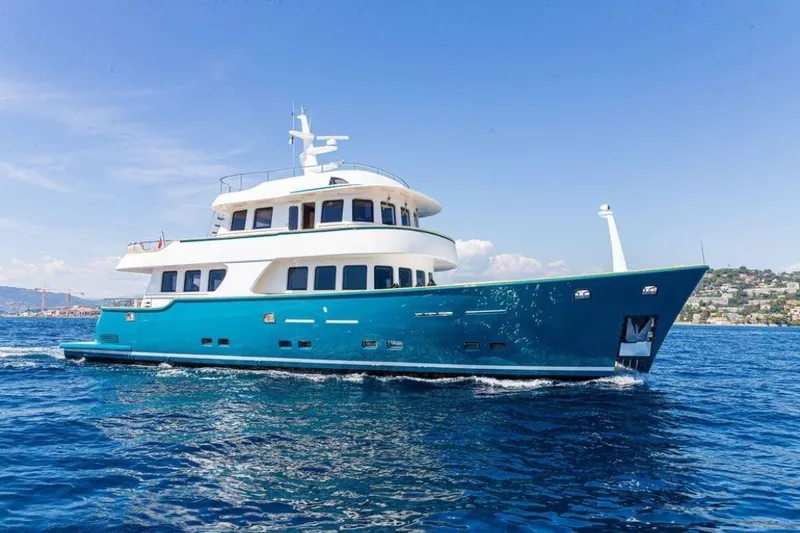  Yacht Photos Pics Luxurious 2021 Terranova Yachts T85 cruising on clear blue waters under a sunny sky.