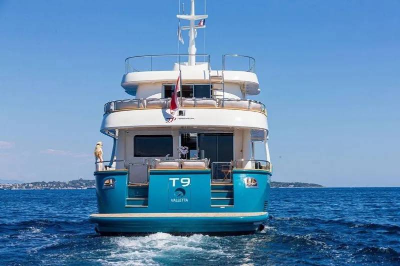  Yacht Photos Pics Terranova Yachts T85, 2021 model, cruising on open sea with clear blue sky.