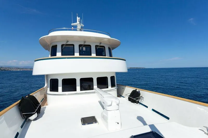  Yacht Photos Pics Terranova Yachts T85, 2021 model, cruising on open sea under clear blue sky.