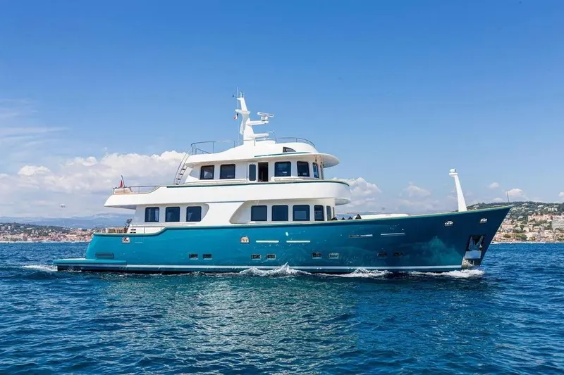  Yacht Photos Pics Luxurious 2021 Terranova Yachts T85 cruising on open sea under clear blue sky.