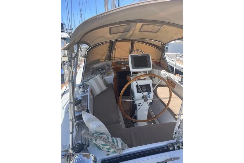 Wind Star Yacht Photos Pics 1986 Liberty 49 sailboat cockpit with steering wheel and navigation equipment.