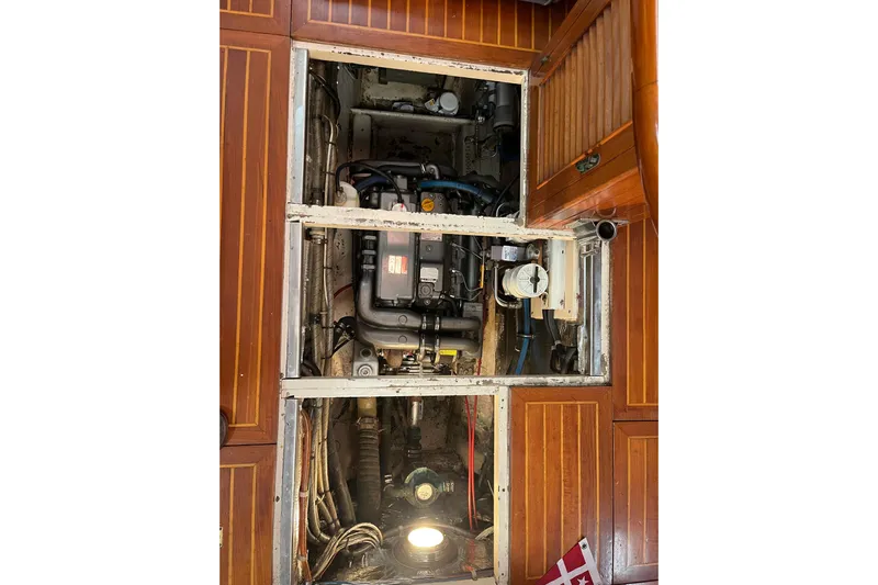 Wind Star Yacht Photos Pics Engine compartment of a 1986 Liberty 49 boat with wooden paneling.