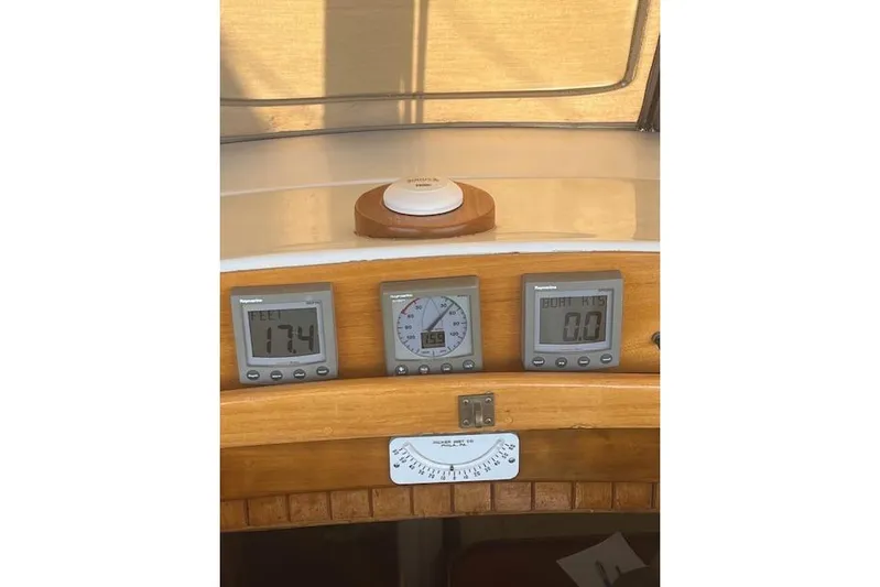 Wind Star Yacht Photos Pics Control panel of a 1986 Liberty 49 boat with digital displays and compass.