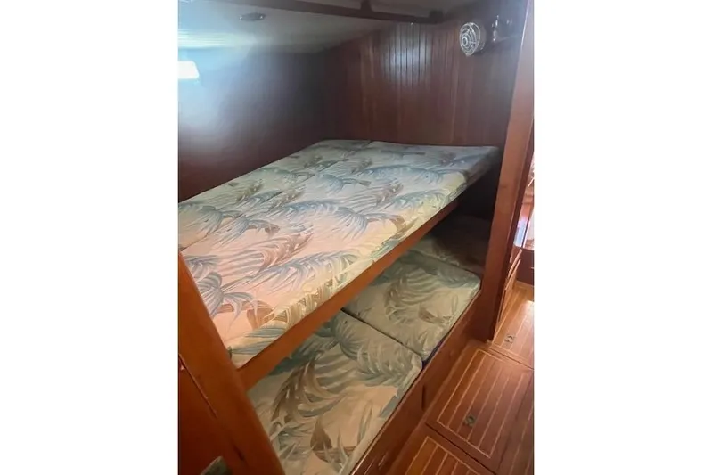 Wind Star Yacht Photos Pics Bunk beds with patterned mattresses in 1986 Liberty 49 yacht cabin.