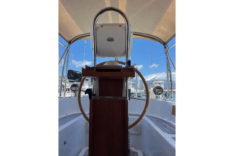 Wind Star Yacht Photos Pics Cockpit view of 1986 Liberty 49 sailboat with wooden steering wheel and canopy.