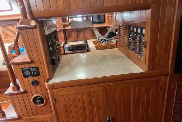 Wind Star Yacht Photos Pics Wooden interior of 1986 Liberty 49 boat with counter and hammock.