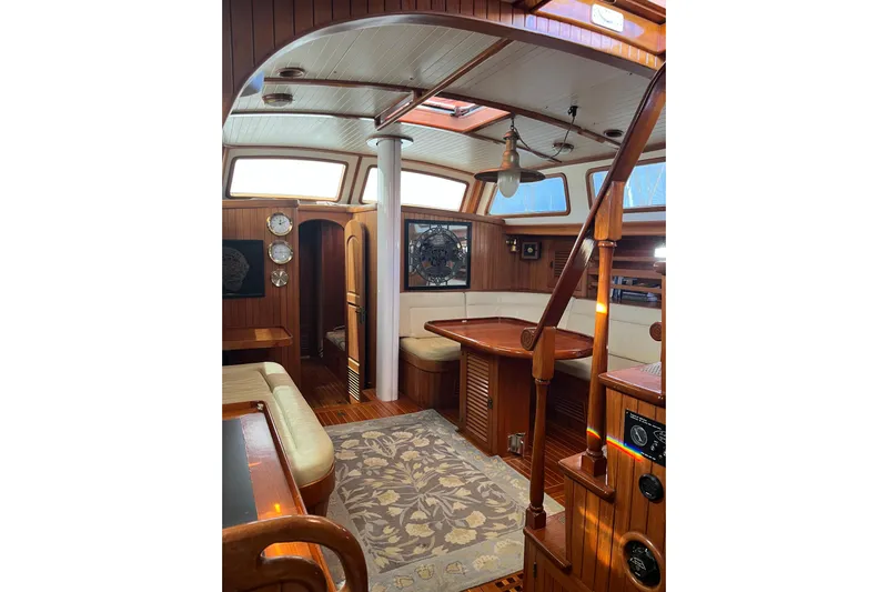 Wind Star Yacht Photos Pics Interior of 1986 Liberty 49 yacht with wooden furnishings and elegant design.
