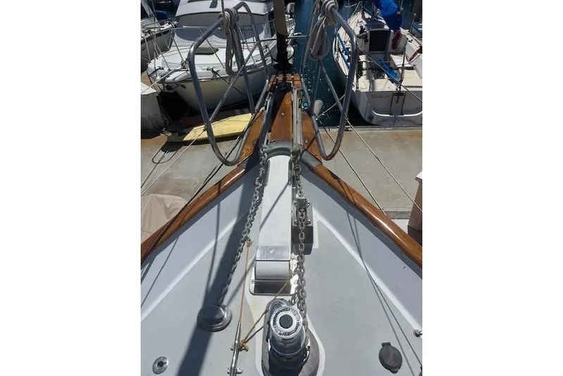 Wind Star Yacht Photos Pics 1986 Liberty 49 sailboat deck with anchor chain and winch in marina.