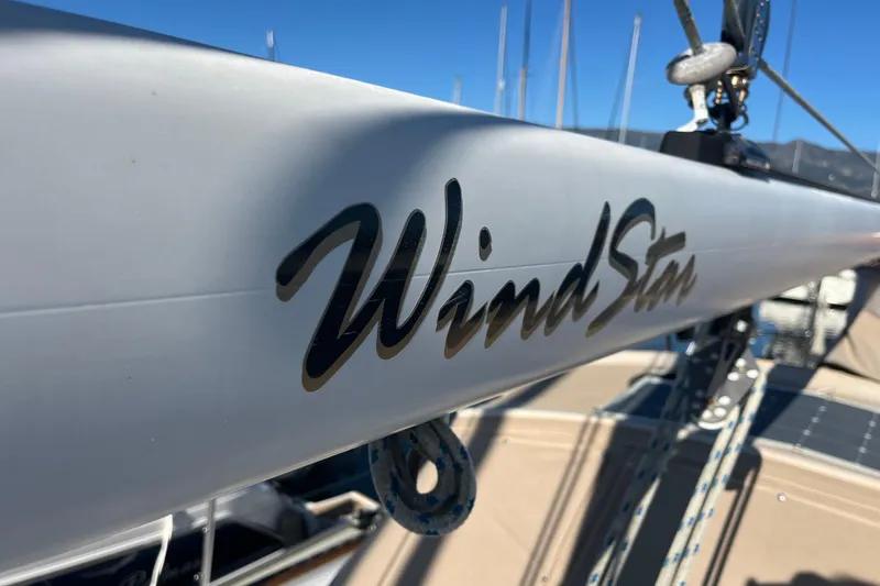 Wind Star Yacht Photos Pics Close-up of "WindStar" text on Liberty 49 sailboat mast, 1986 model.