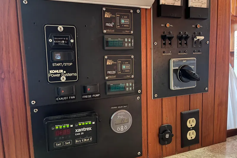 Wind Star Yacht Photos Pics Electrical control panel on a 1986 Liberty 49 boat with various switches and meters.