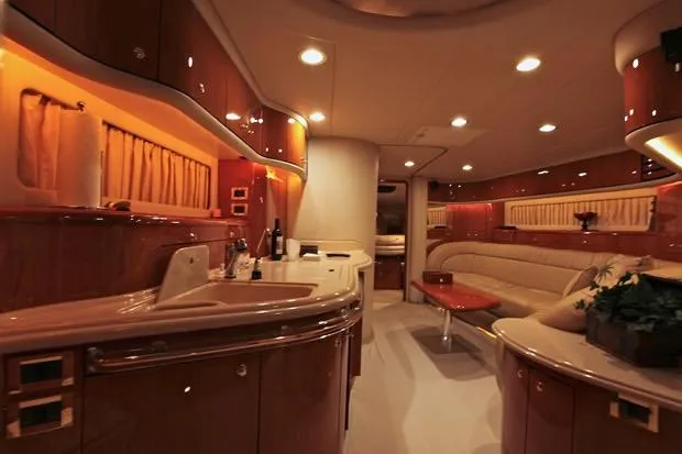 Good News Yacht Photos Pics Luxurious interior of a 1998 Sea Ray 540 Sundancer yacht with elegant wood finishes.