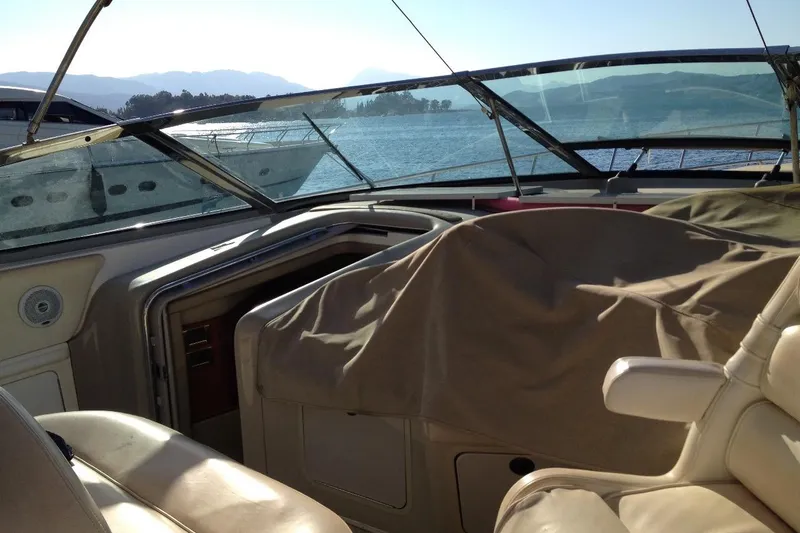 Good News Yacht Photos Pics 1998 Sea Ray 540 Sundancer yacht interior with covered seating, overlooking serene waters.