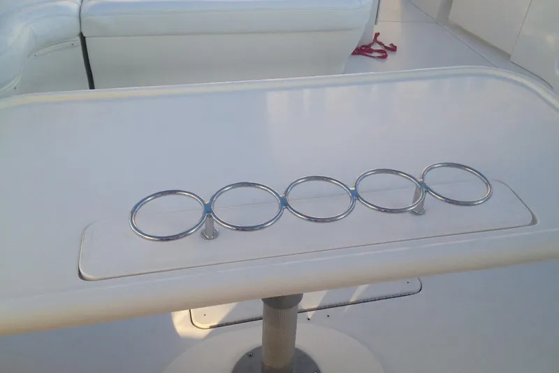 Good News Yacht Photos Pics Cup holders on a 1998 Sea Ray 540 Sundancer boat table.