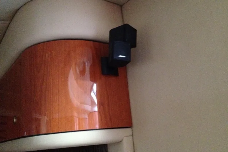 Good News Yacht Photos Pics Bose speaker mounted on 1998 Sea Ray 540 Sundancer's polished wooden interior.