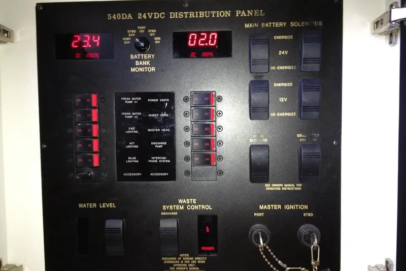Good News Yacht Photos Pics 1998 Sea Ray 540 Sundancer 24VDC distribution panel with battery monitor and control switches.