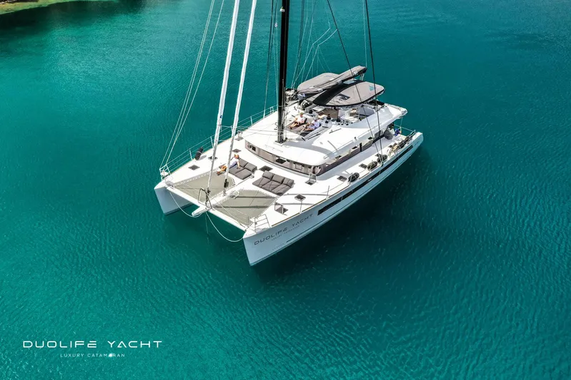 Duolife Yacht Yacht Photos Pics Luxury Lagoon 620 catamaran, 2019 model, sailing in clear turquoise waters.