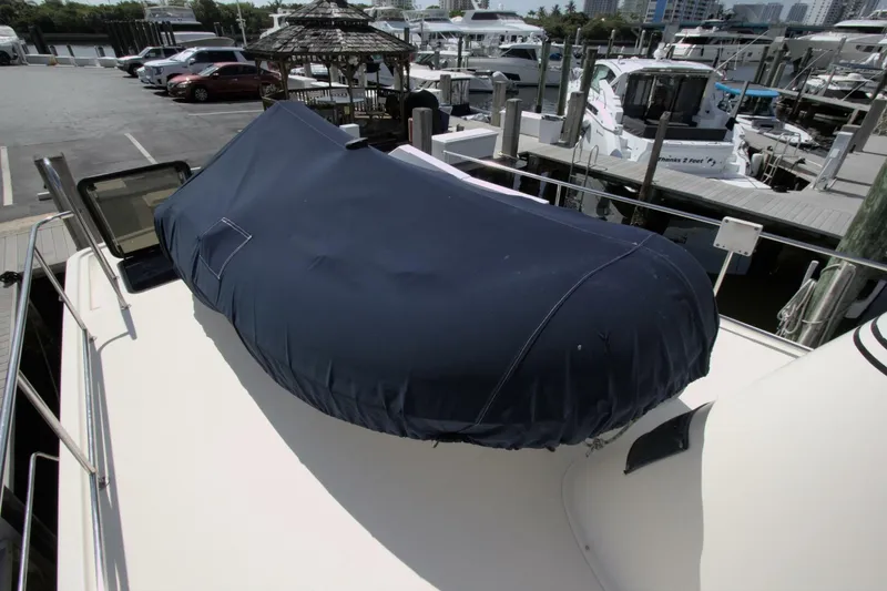 Hercules Yacht Photos Pics Nordic Tug 42 Millennium 2000 with covered equipment on deck at marina.