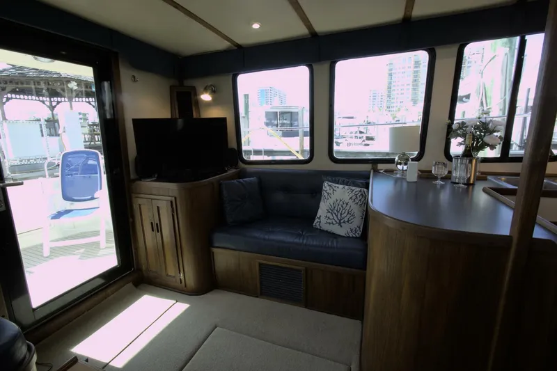 Hercules Yacht Photos Pics Interior of 2000 Nordic Tug 42 Millennium with cozy seating and modern decor.