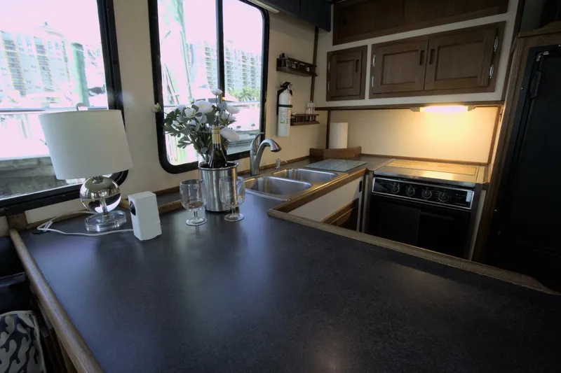 Hercules Yacht Photos Pics Interior of 2000 Nordic Tug 42 Millennium, featuring a cozy kitchen with modern amenities.