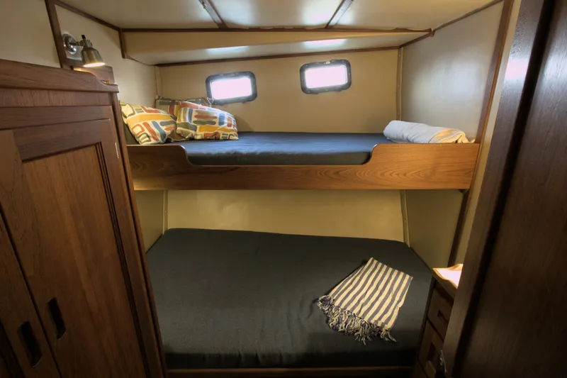 Hercules Yacht Photos Pics Cozy cabin with bunk beds in 2000 Nordic Tug 42 Millennium yacht.