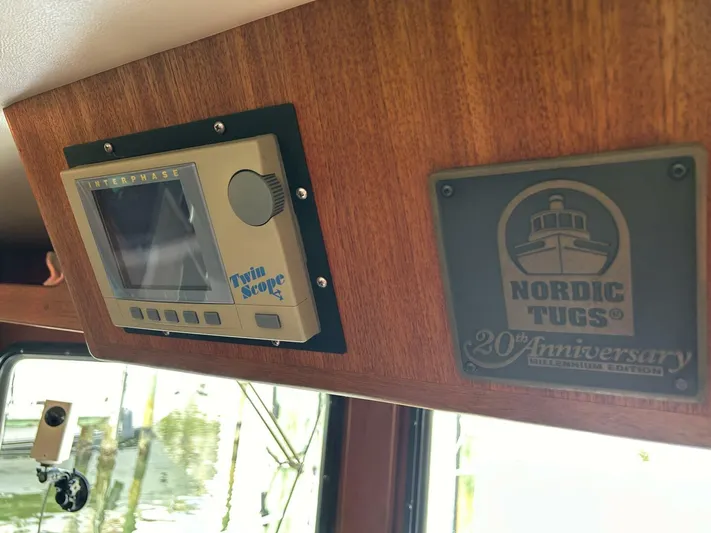 Hercules Yacht Photos Pics Nordic Tug 42 Millennium 2000 interior with Interphase Twin Scope and anniversary plaque.