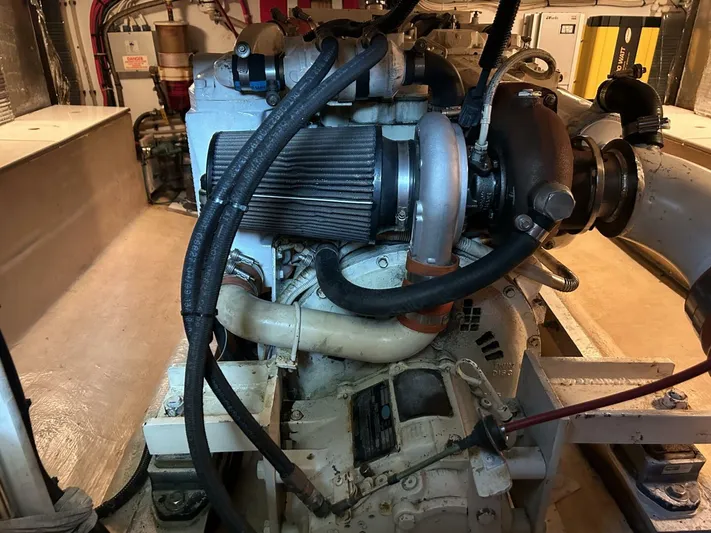 Hercules Yacht Photos Pics Engine room of a 2000 Nordic Tug 42 Millennium, showcasing mechanical components and wiring.