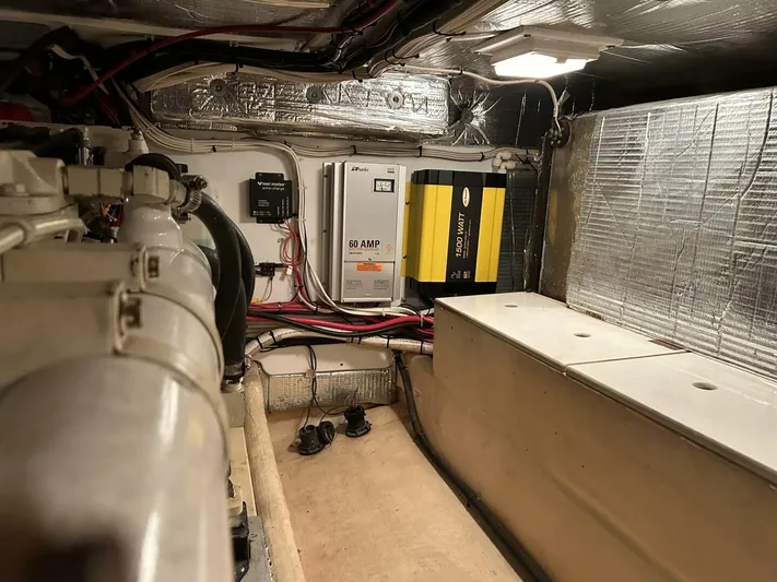 Hercules Yacht Photos Pics Engine room of a 2000 Nordic Tug 42 Millennium, featuring electrical components and wiring.