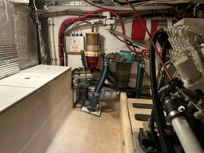 Hercules Yacht Photos Pics Engine room of a 2000 Nordic Tug 42 Millennium with visible machinery and wiring.