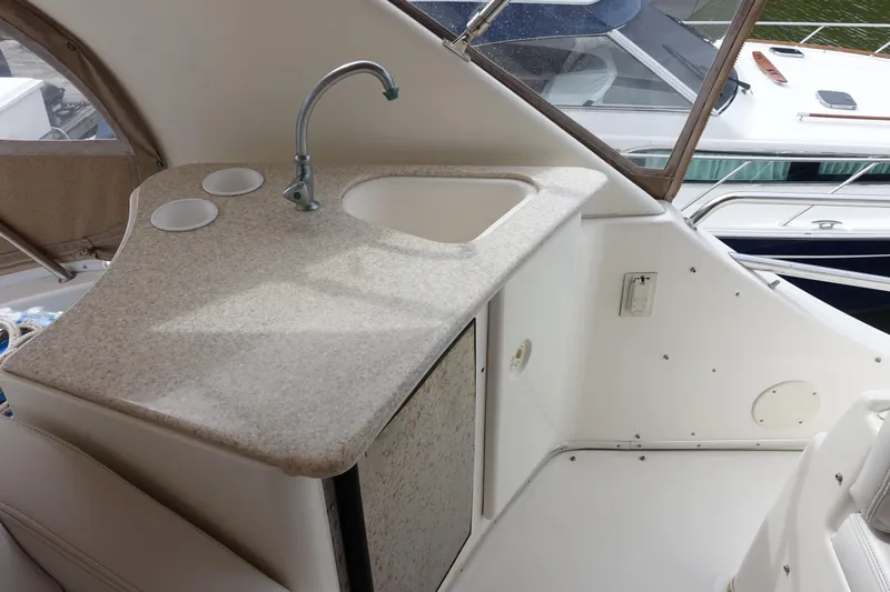  Yacht Photos Pics 2001 Silverton 410 Sport Bridge yacht interior with sink and countertop.