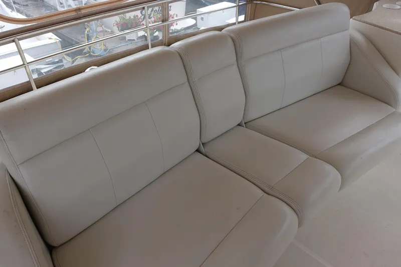  Yacht Photos Pics 2001 Silverton 410 Sport Bridge interior with beige leather seating.