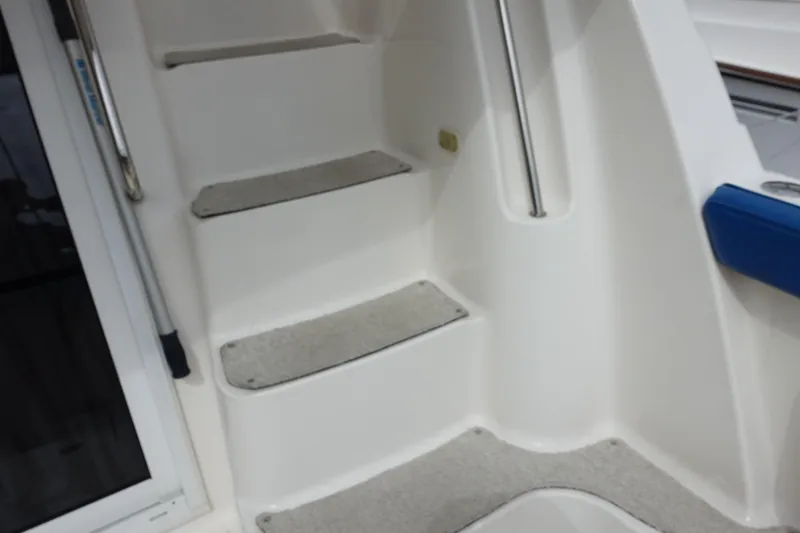  Yacht Photos Pics Staircase on a 2001 Silverton 410 Sport Bridge yacht, featuring non-slip steps.