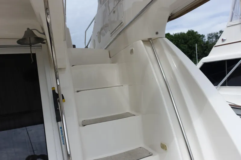  Yacht Photos Pics Staircase on 2001 Silverton 410 Sport Bridge yacht with bell and railing.